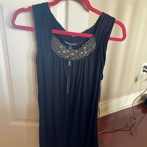 Sleeveless black top with rhinestones